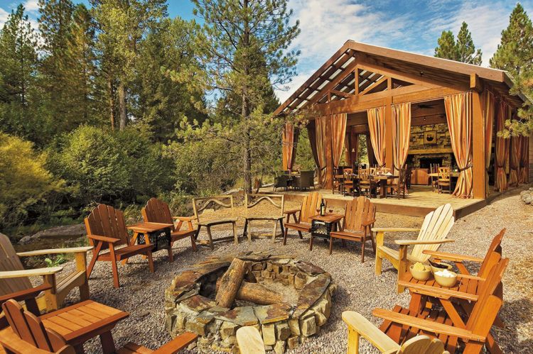 Campfire and adirondack chairs at The Resort at Paws Up